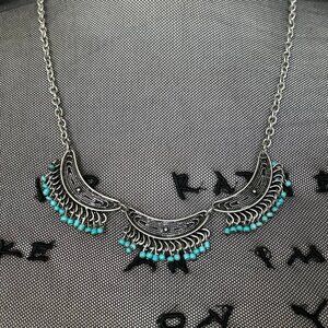Silver and blue beaded crescent necklace
